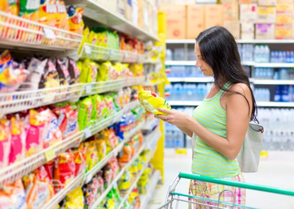 A woman looking at snacks in the store